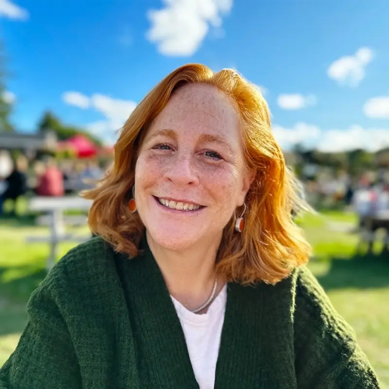 Marlene Smurzynski, Executive Director and Head of Epidemiology at Genesis Research Group, smiling outdoors.
